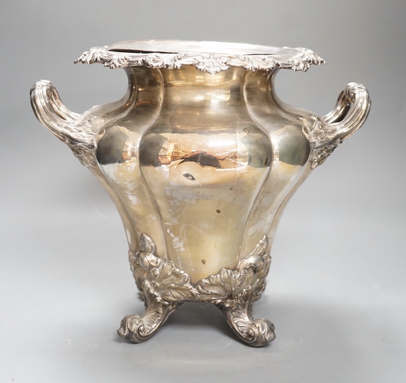 A William IV Old Sheffield plate twin handled wine cooler, with liner, acanthus scrolled borders, on four scrolled feet Height 28cm